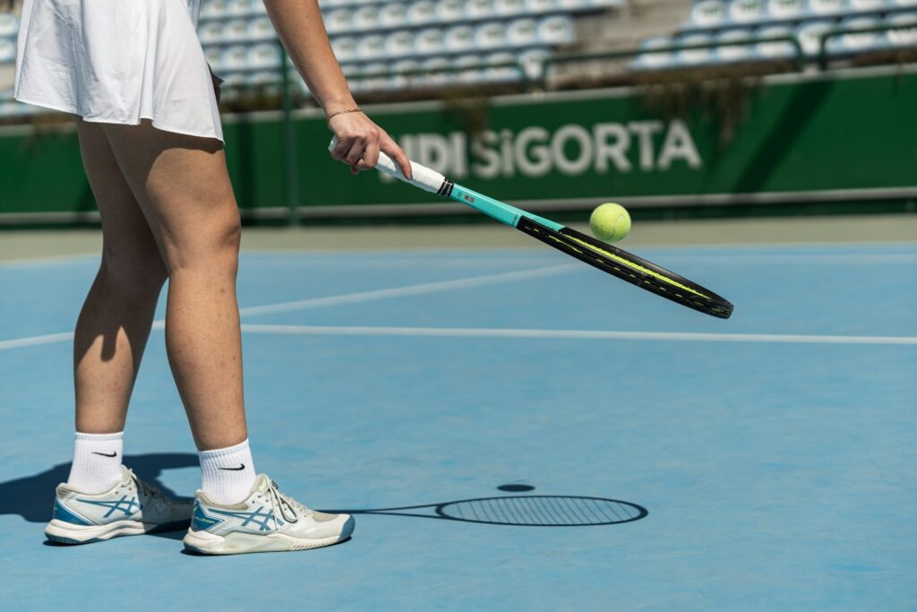 a tennis player prepares to hit a tennis ball